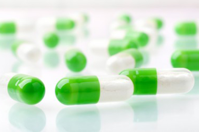 Image of green and white capsules