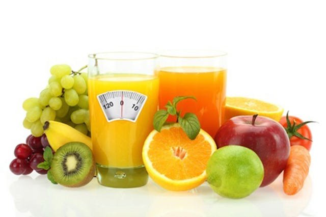 Image of scales and fruit drink and a variety of fruits
