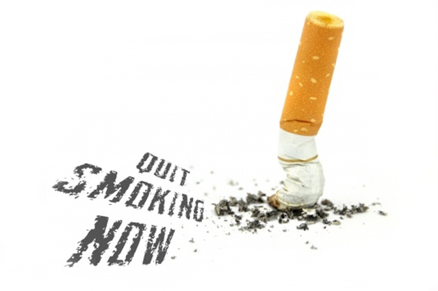 Image of stubbed cigarette with the words Quit Smoking Now alongside