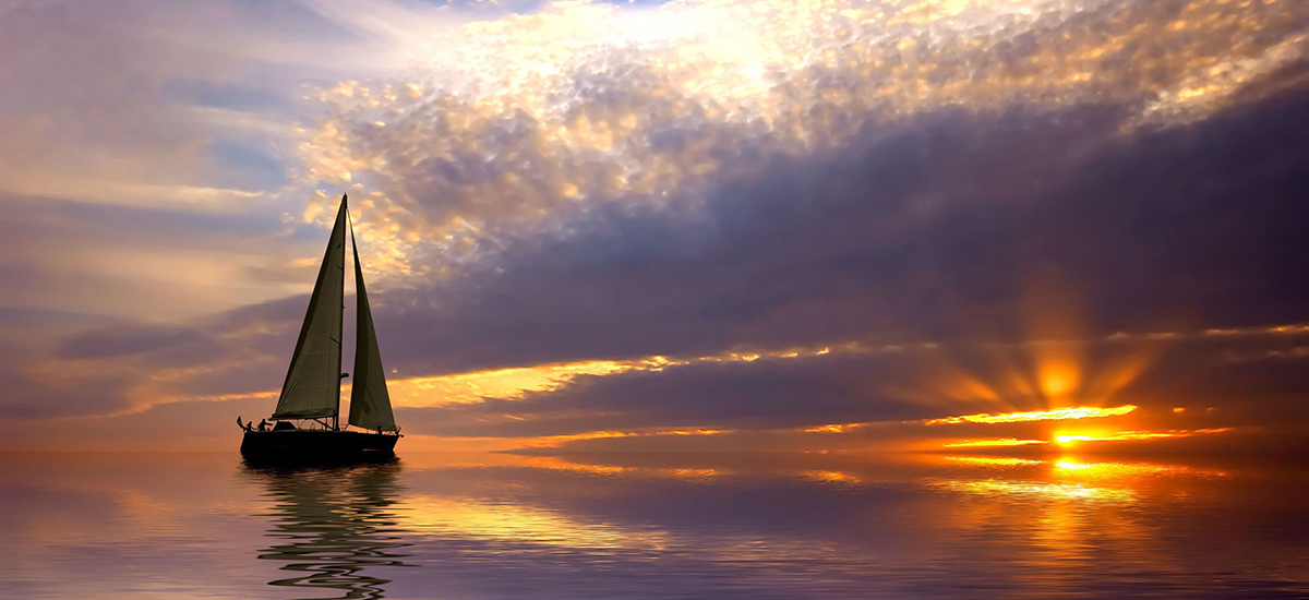 Slide Image of boat on a calm river at sunset