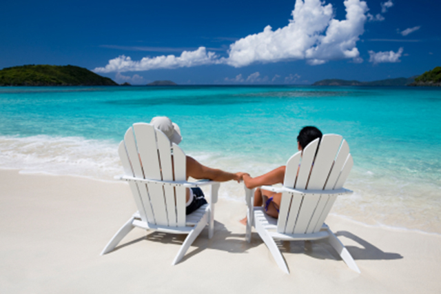 Berach view with chairs and relaxing couple